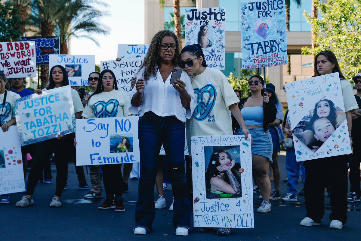 Regina Lacerda, left, reads a speech about her daughter, Tabatha Tozzi, as Alicia Lozoya stands ...