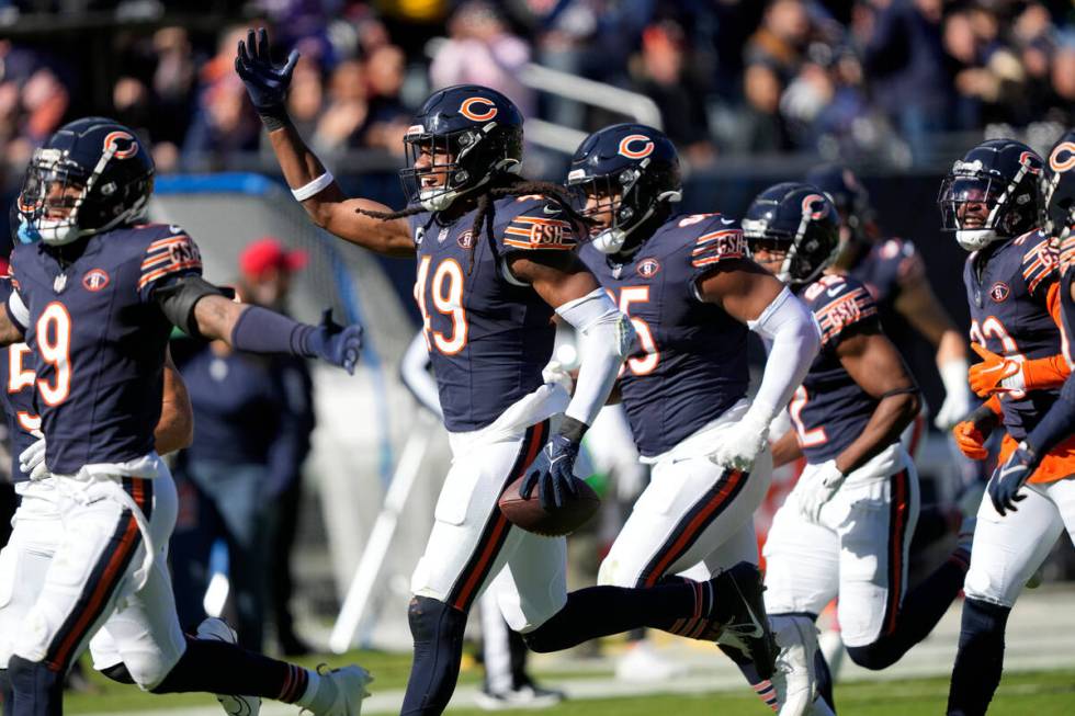 Chicago Bears linebacker Tremaine Edmunds (49) celebrates after intercepting a pass against the ...