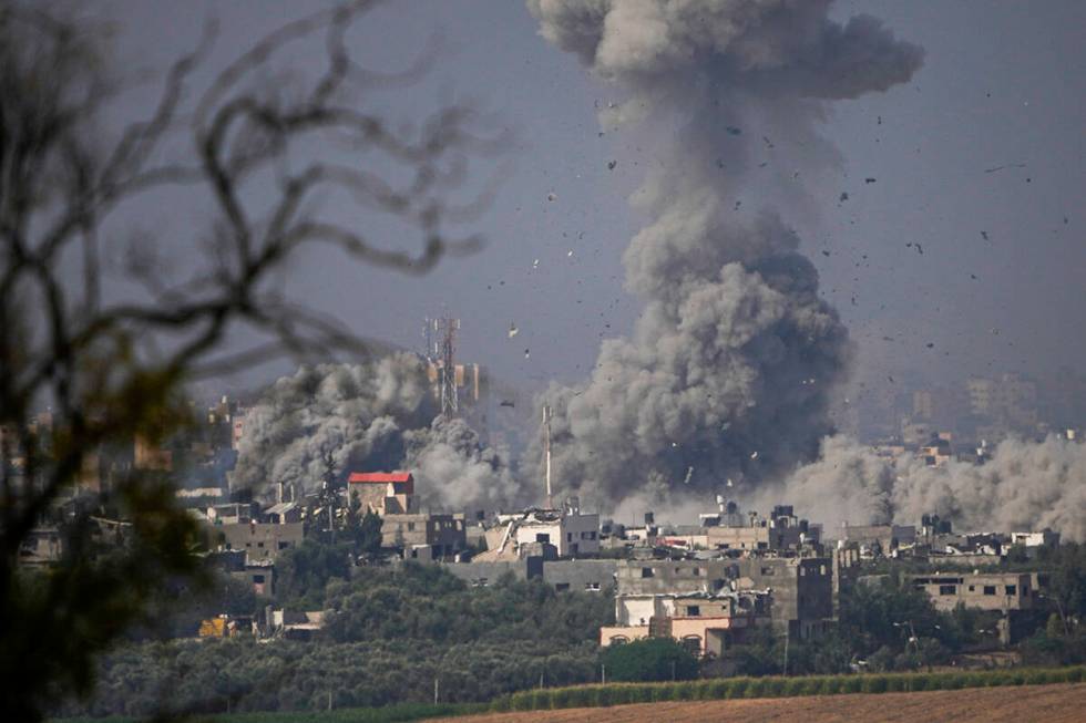 Smoke rises following an Israeli airstrike in the Gaza Strip, as seen from southern Israel, Mon ...