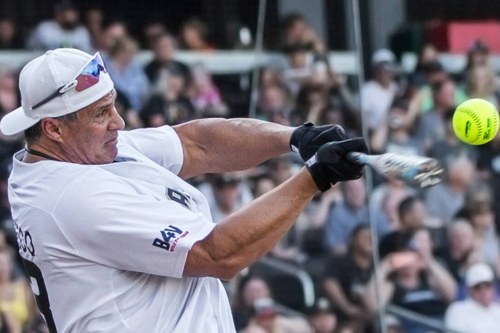 Former Major League Baseball player Jose Canseco takes a swing during the home run derby at the ...