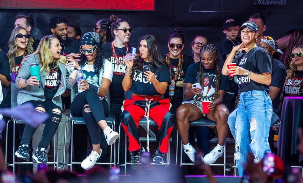 Aces players laugh with coach Becky Hammon during their championship celebration at Toshiba Pla ...