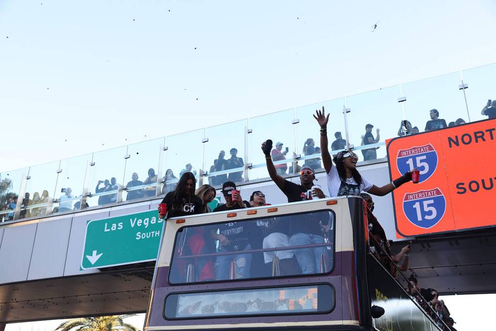 The world champion Las Vegas Aces ride a bus as they parade from Tropicana Avenue to Toshiba Pl ...