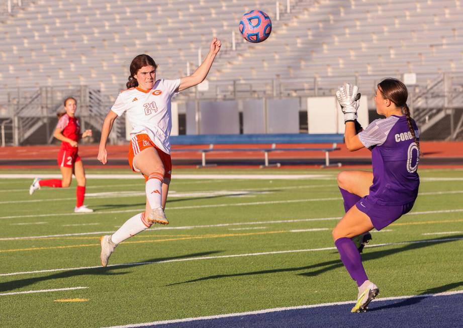 Bishop Gorman’s Hunter Borgel (24) takes a shot against Coronado’s Megan Kingman ...