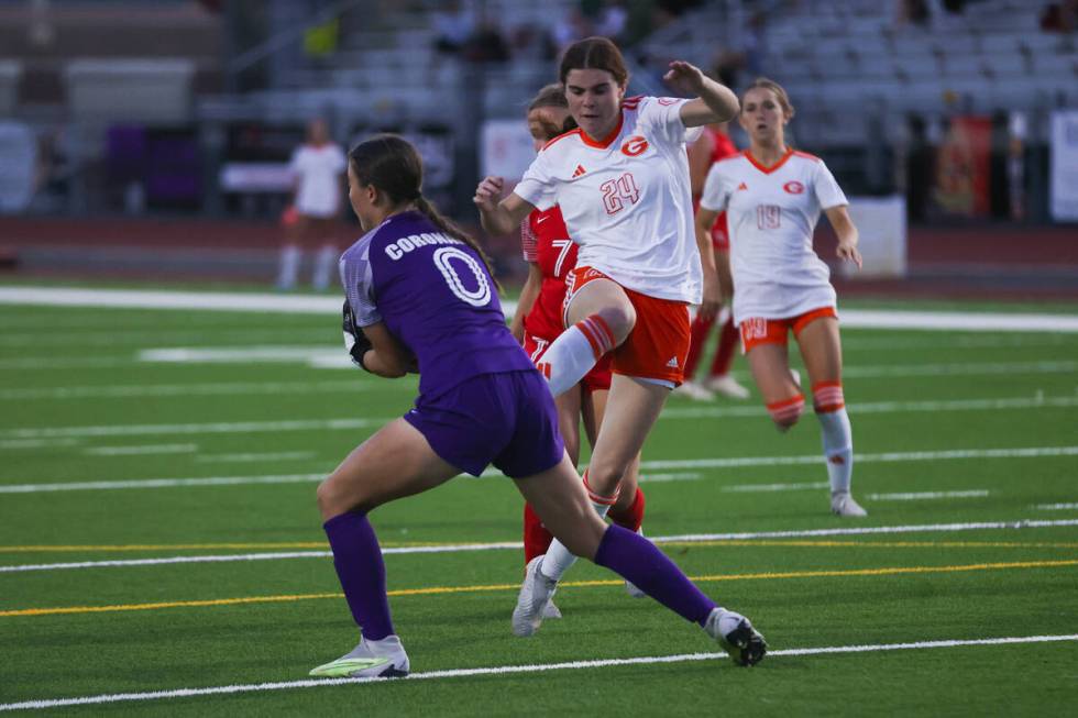 Coronado’s Megan Kingman (0) blocks a shot taken by Bishop Gorman’s Hunter Borgel ...