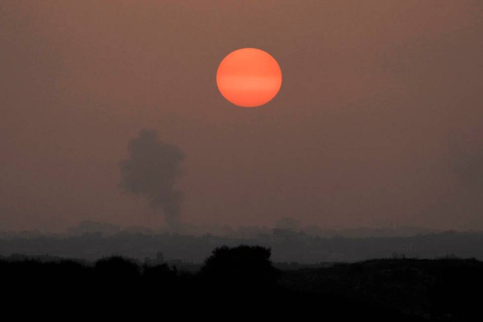 Smoke rises following an Israeli airstrike in the Gaza Strip, as seen from southern Israel, Mon ...