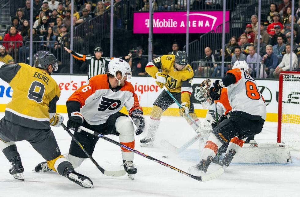 Golden Knights center Ivan Barbashev (49) works to shoot on Philadelphia Flyers goaltender Cart ...