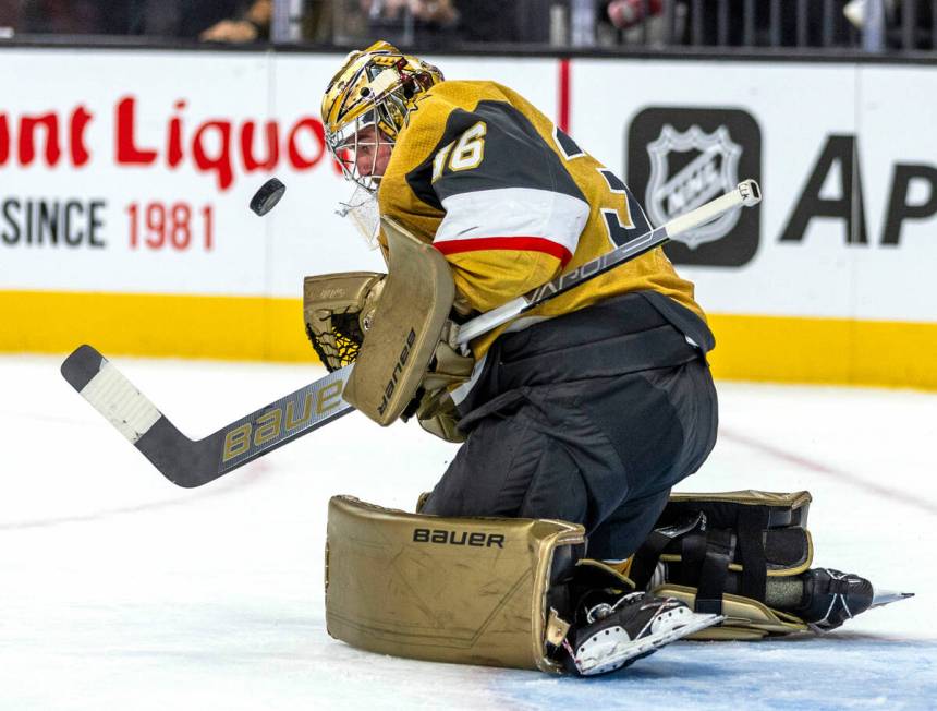 Golden Knights goaltender Logan Thompson (36) deflects away a shot by the Philadelphia Flyers d ...