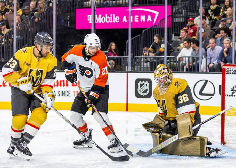 Golden Knights goaltender Logan Thompson (36) catches a puck in his lap shot from Philadelphia ...