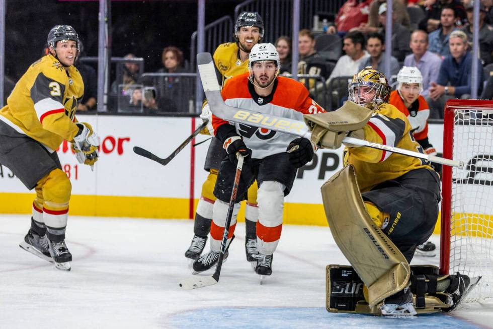 Golden Knights goaltender Logan Thompson (36) deflects away a shot from the Philadelphia Flyers ...