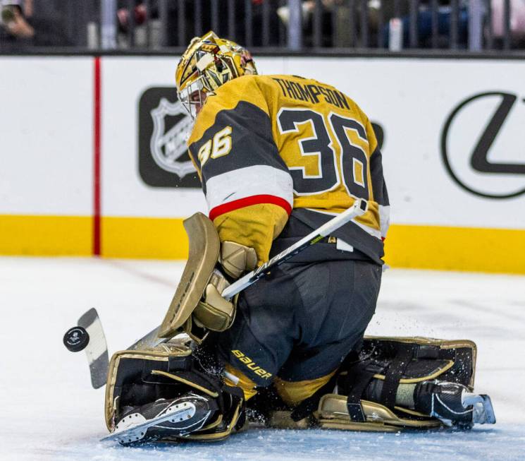 Golden Knights goaltender Logan Thompson (36) deflects away a shot from the Philadelphia Flyers ...