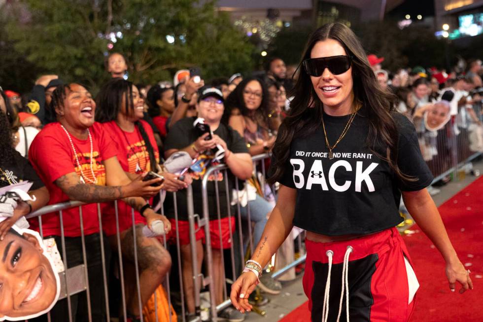 Las Vegas Aces guard Kelsey Plum visits with fans during her team’s celebration of their ...