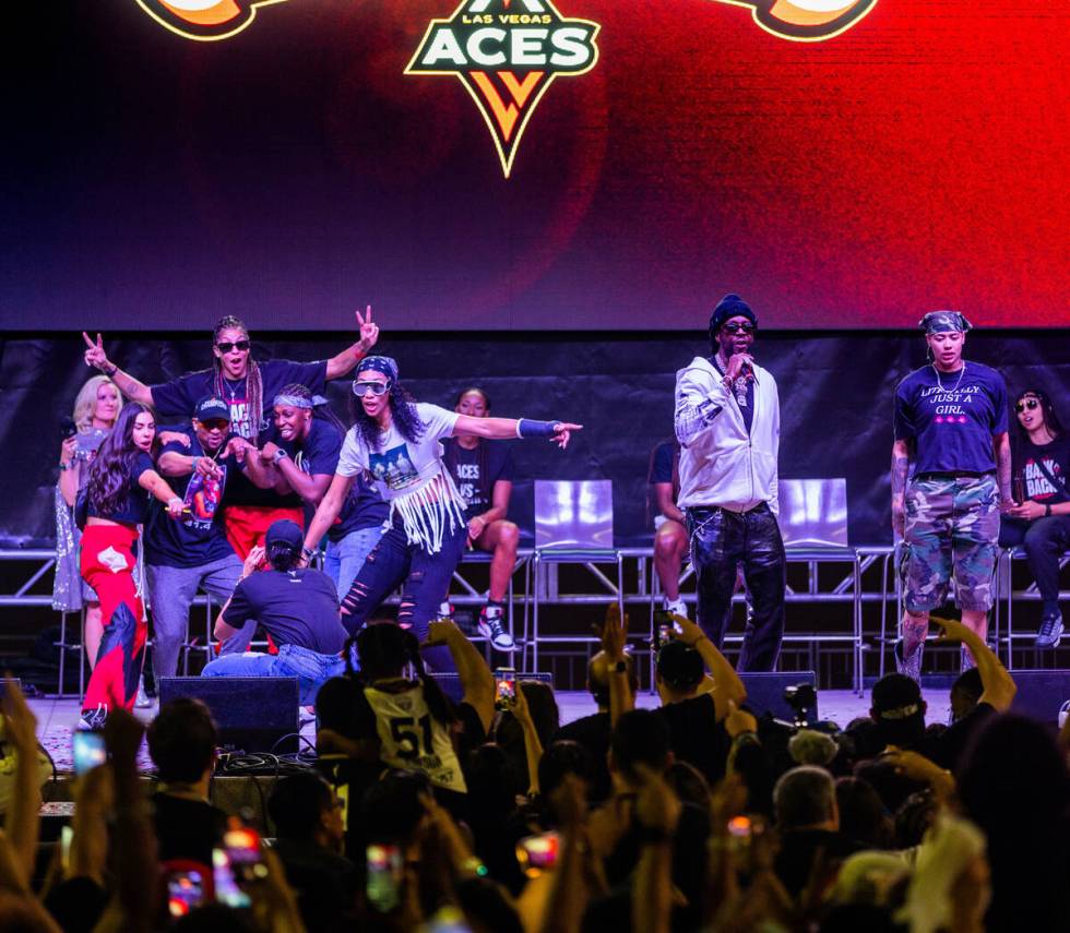 Aces players dance on stage as rapper 2 Chainz performs during their championship celebration ...