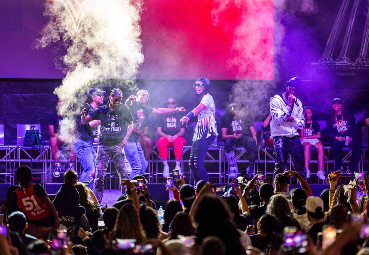 Aces players dance on stage as rapper 2 Chainz performs during their championship celebration a ...