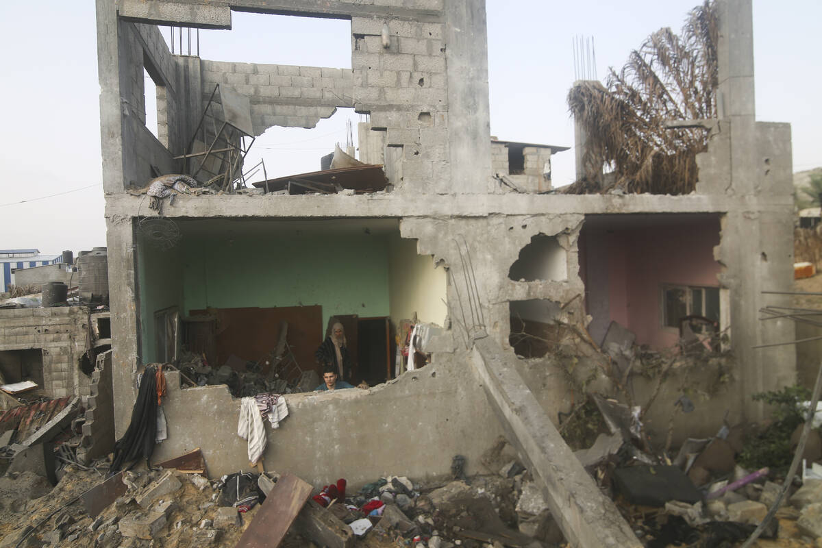 A building destroyed in the Israeli bombing of the Gaza Strip is seen in Rafah on Tuesday, Oct. ...