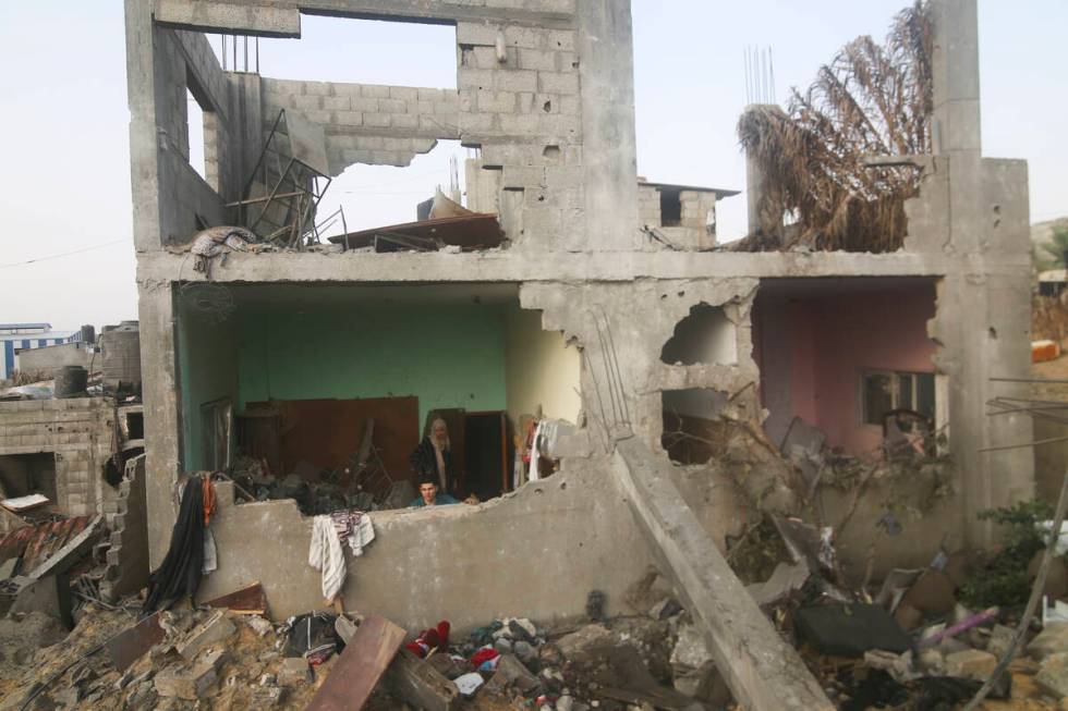 A building destroyed in the Israeli bombing of the Gaza Strip is seen in Rafah on Tuesday, Oct. ...