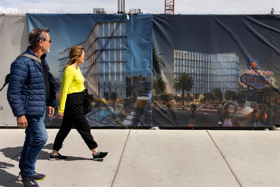 Pedestrian walk past a rendering of the Dream Las Vegas hotel-casino at the construction site a ...