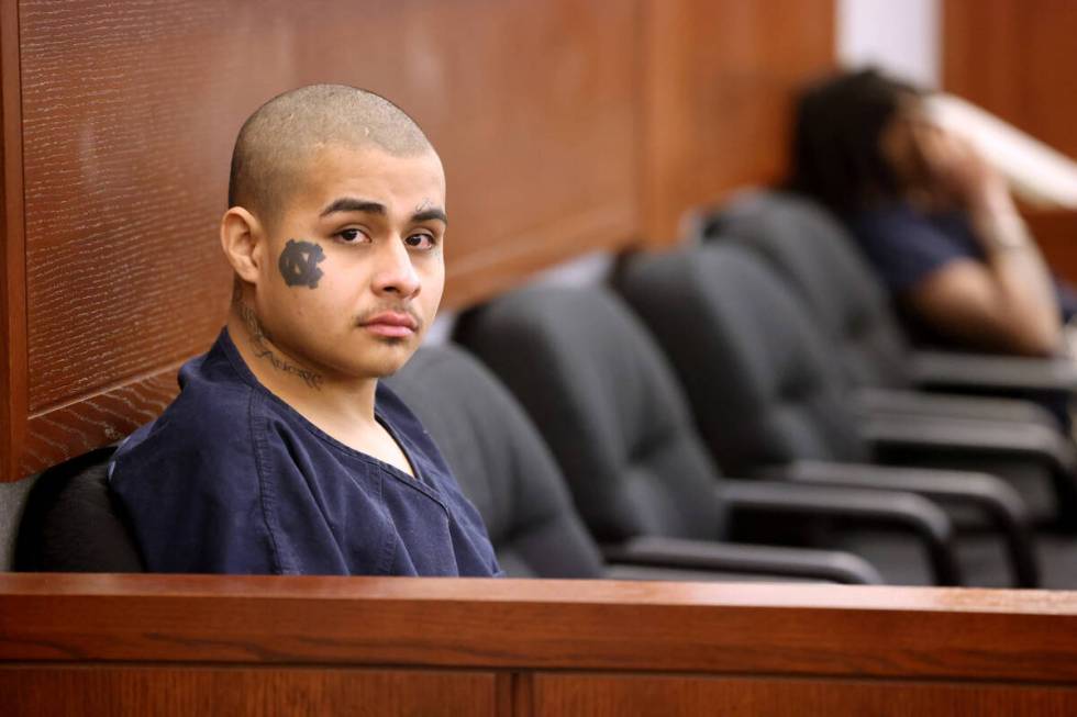 Jesus Ayala, 18, left, and Jzamir Keys, 16, wait to appear in court at the Regional Justice Cen ...