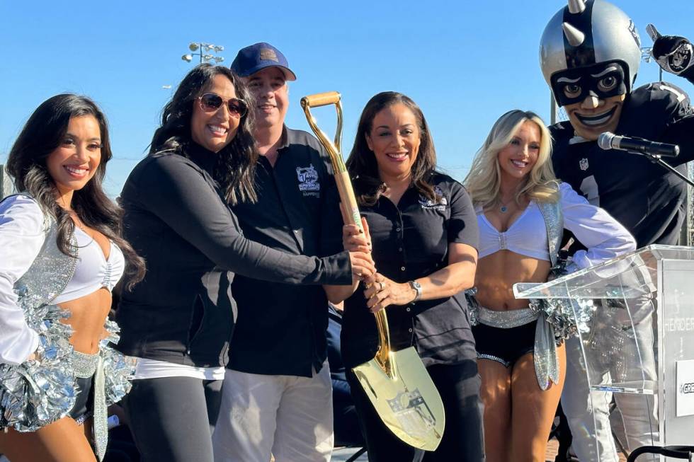 Raiderettes and Raider Rusher join Jennie Patel, VP social responsibility of the Arizona Super ...