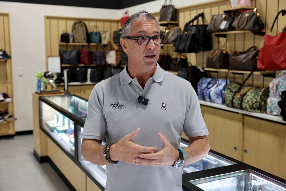 Owner Michael Mack talks about designer handbags at his Max Pawn Luxury location on South Decat ...