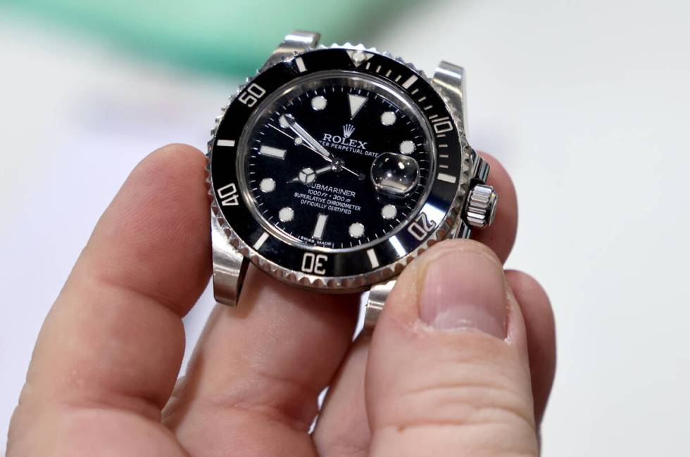 An employee cleans a Rolex watch at Max Pawn Luxury on South Decatur Boulevard in Las Vegas, Fr ...