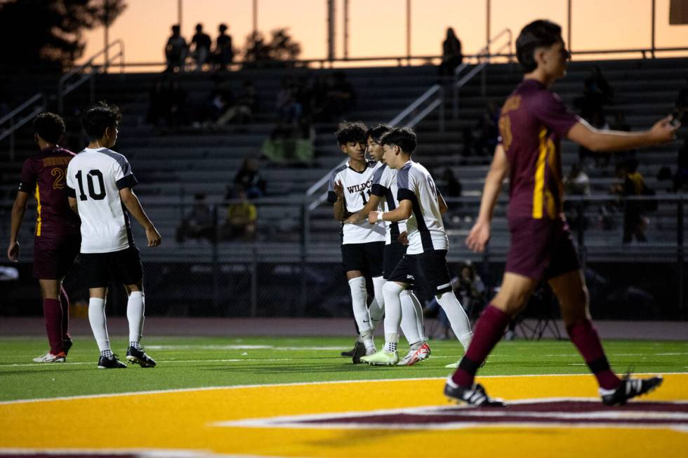 Las Vegas surrounds their Sebastian Fronda after he scored on Eldorado during the first half of ...