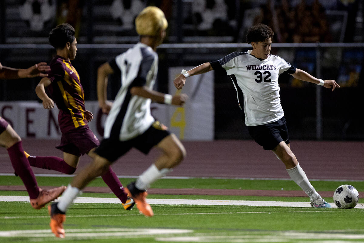 Las Vegas' Bautista Silva (32) winds up to kick during the first half of a boys high school soc ...