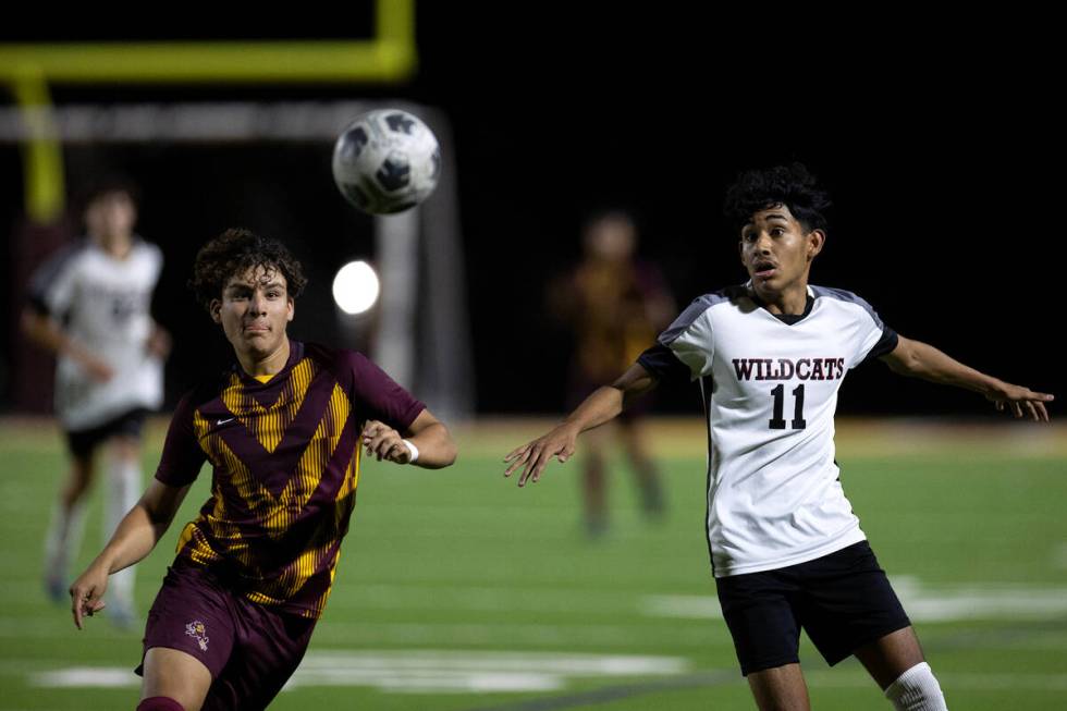 Eldorado's Ivan Martinez (17) runs for the ball against Las Vegas' Sebastian Fronda (11) during ...