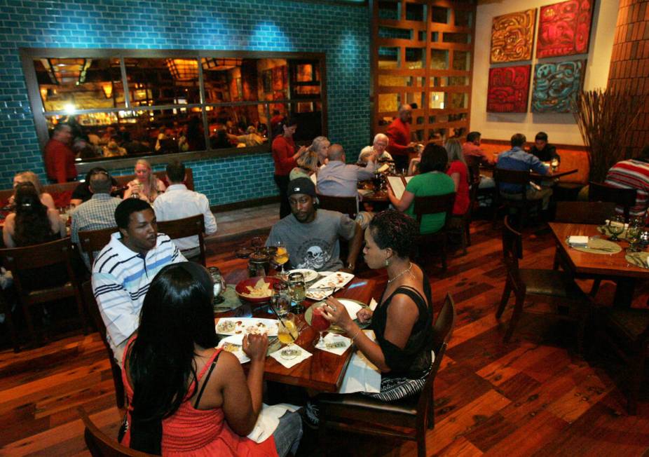 Customers enjoy their meal at ISLA Mexican Kitchen & Tequila Bar in Treasure Island Hotel & Cas ...