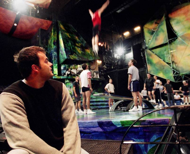 Patrick Blais, left, watches fellow cast members of Mystere rehearse Friday, Nov. 7, 2003 at Tr ...