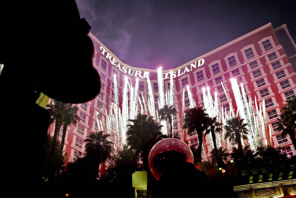 Fireworks erupt during a performance of the "Sirens of ti" show in front of the "ti" Treasure I ...