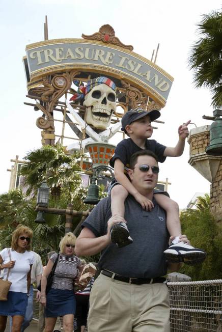 Craig Fuco walks with his nephew Ryan Walsh, 5, on his shoulders on his way to the pirate show ...