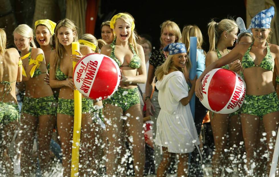 Contestants from the Miss Hawaiian Tropic contest cheer on their teammates during the competiti ...