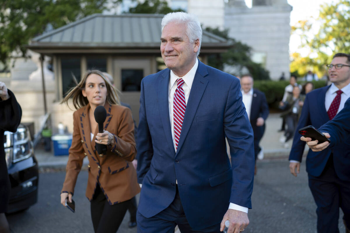 House Majority Whip Rep. Tom Emmer, R-Minn., followed by reporters, leaves the Republican caucu ...