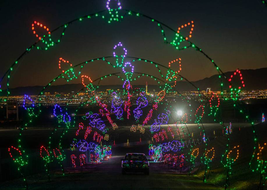 Cars tour through Glittering Lights at Las Vegas Motor Speedway in Las Vegas on Monday Nov. 30, ...