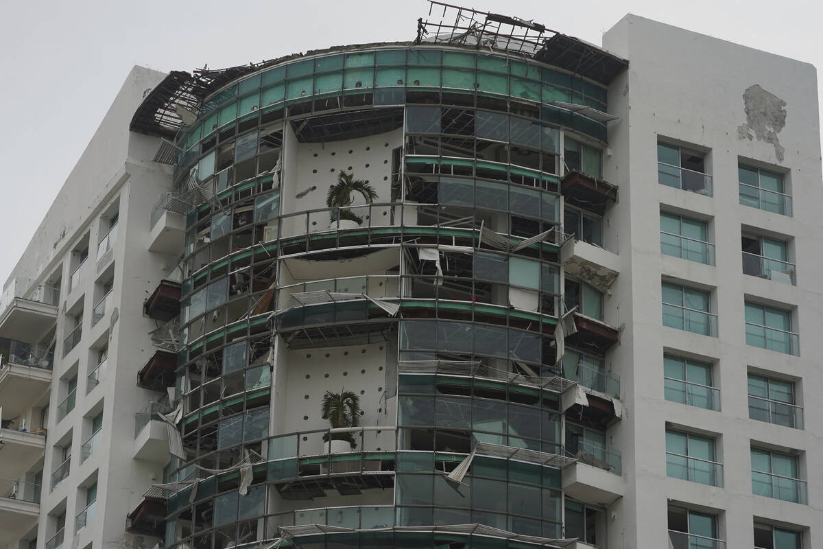 A damaged building stands after Hurricane Otis ripped through Acapulco, Mexico, Wednesday, Oct. ...