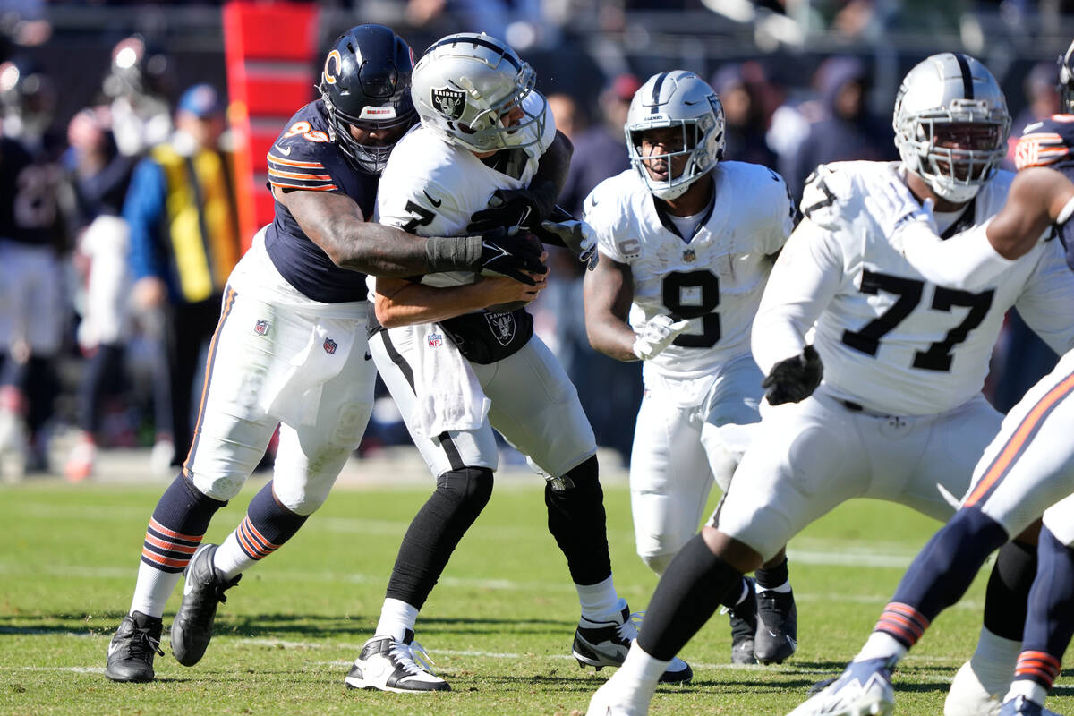 Chicago Bears defensive tackle Justin Jones (93) sacks Las Vegas Raiders quarterback Brian Hoye ...