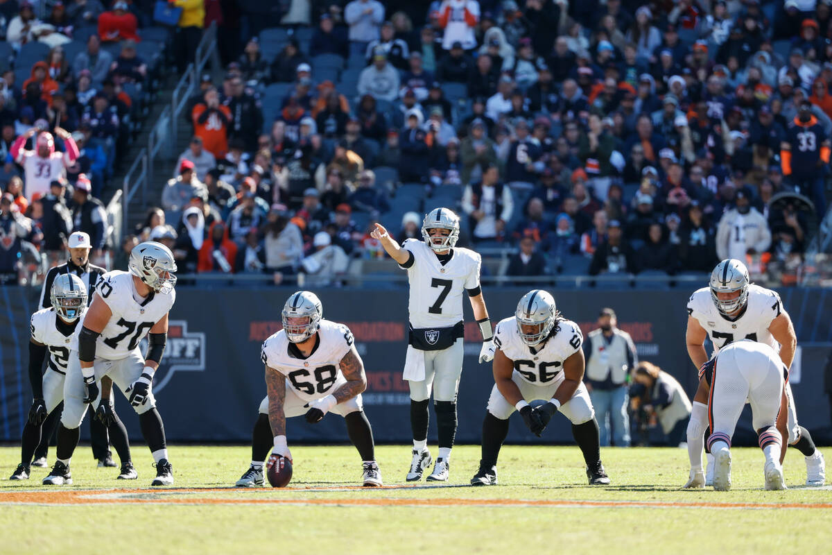 Las Vegas Raiders quarterback Brian Hoyer (7) yells to his teammates during the second half of ...