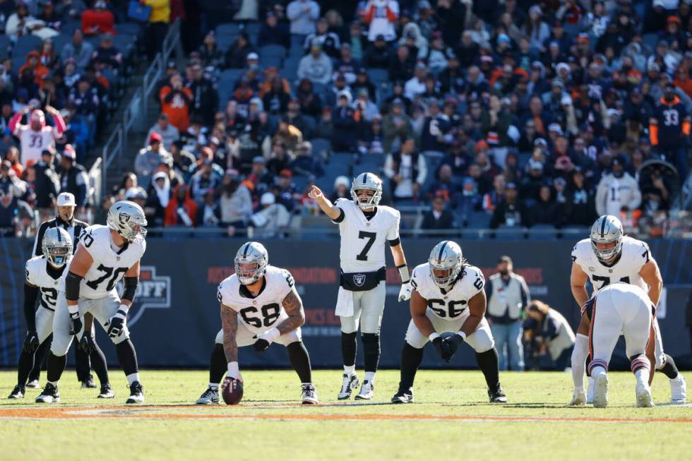 Las Vegas Raiders quarterback Brian Hoyer (7) yells to his teammates during the second half of ...