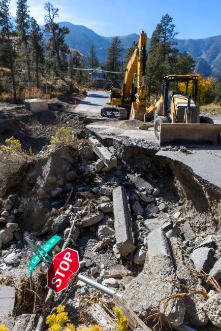 A main road into the Rainbow Canyon subdivision is still damaged and closed as repairs continue ...