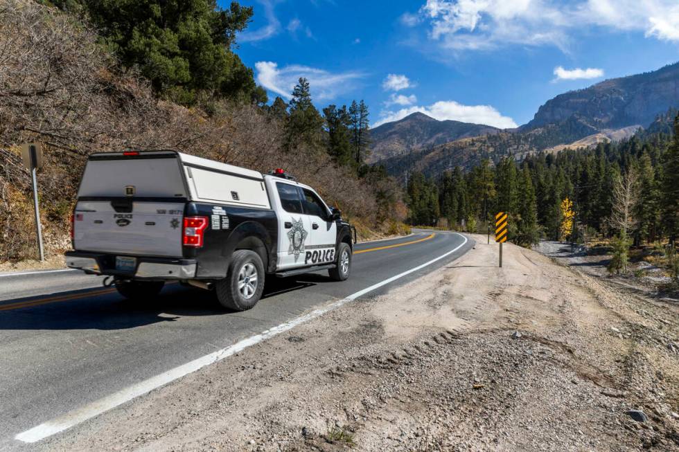 A Metro vehicle makes its way along a repaired section of Kyle Canyon Road as repairs continue ...