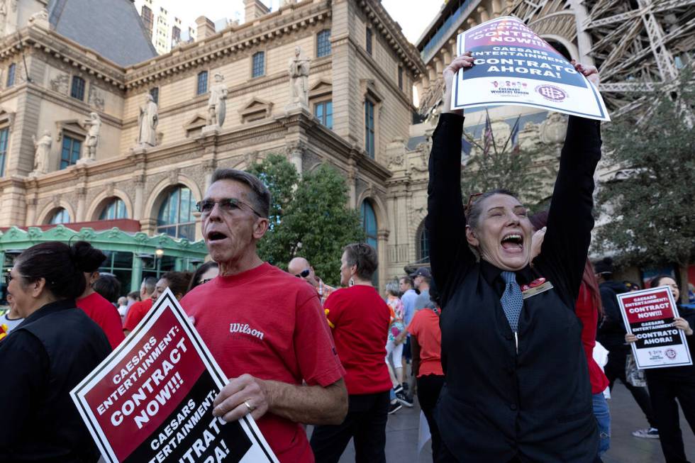 Jimmy Tyner, left, and Faye Warrick, right, join thousands of culinary union members as they pr ...