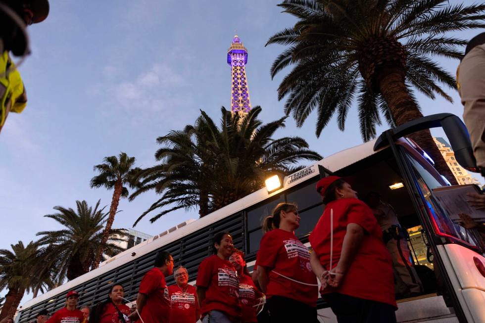 Culinary union members are loaded into transport busses after being arrested for blocking traff ...