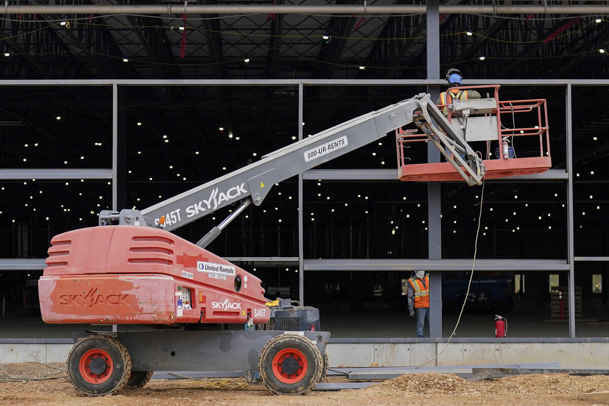 A Sky Jack lift is operated outside a Hanwha QCells Solar plant, Monday, Oct. 16, 2023, in Cart ...