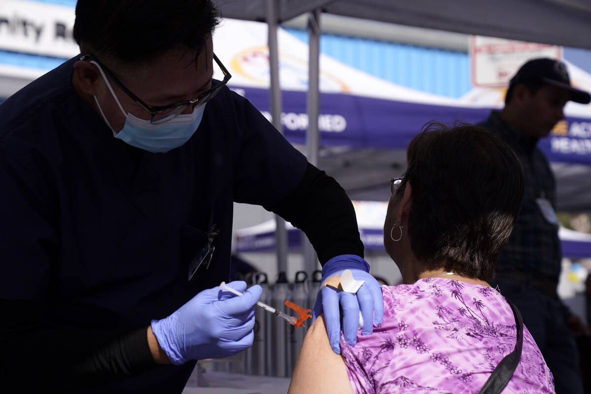 FILE - A nurse gives a flu vaccination on Oct. 28, 2022, in Lynwood, Calif. On Thursday, the Co ...