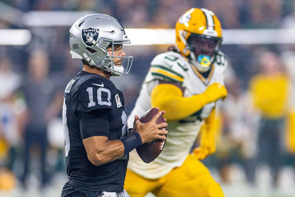 Raiders quarterback Jimmy Garoppolo (10) looks to pass against Green Bay Packers defensive tack ...