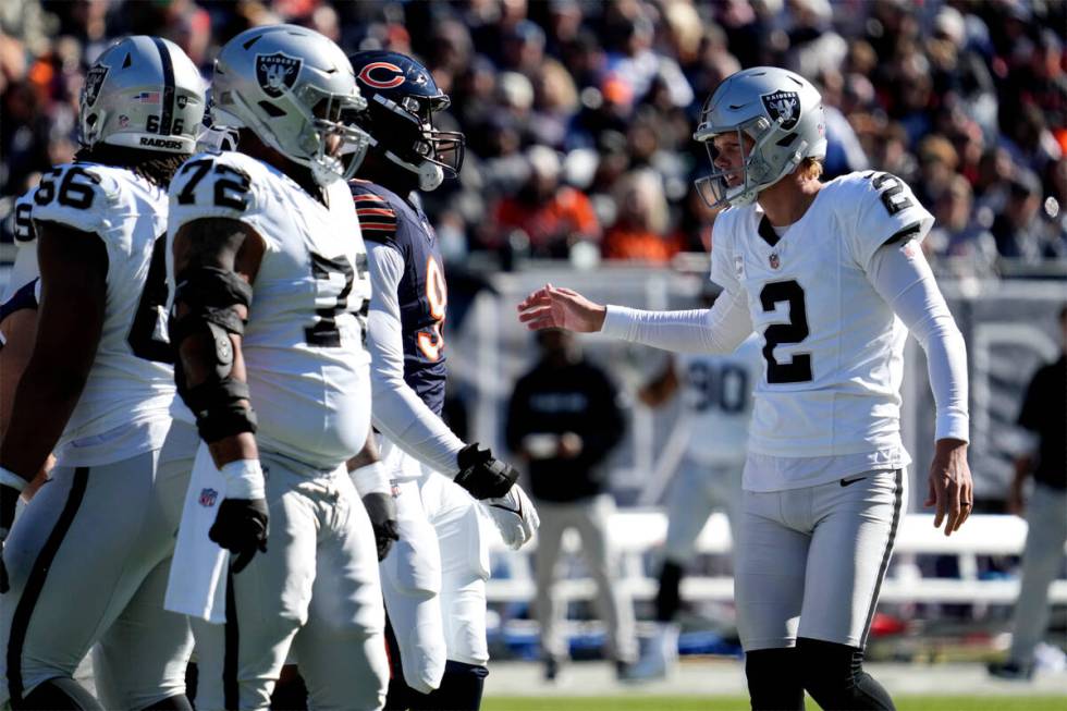 Las Vegas Raiders place kicker Daniel Carlson (2) is congratulated after kicking a 40-yard fiel ...