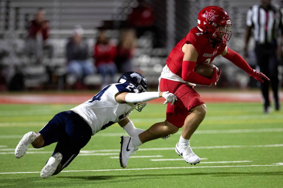 Shadow Ridge defensive back Anthony Ramirez (24) attempts to tackle Arbor View wide receiver Do ...