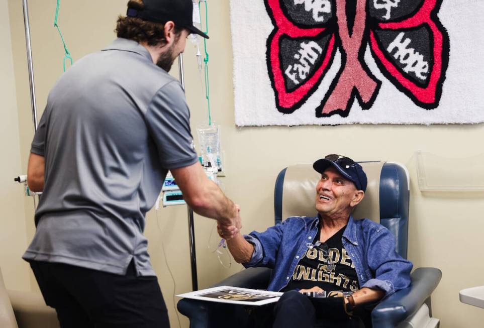 Shea Theodore, defenseman for the Golden Knights, greets patient Roy Beheler at the Comprehensi ...