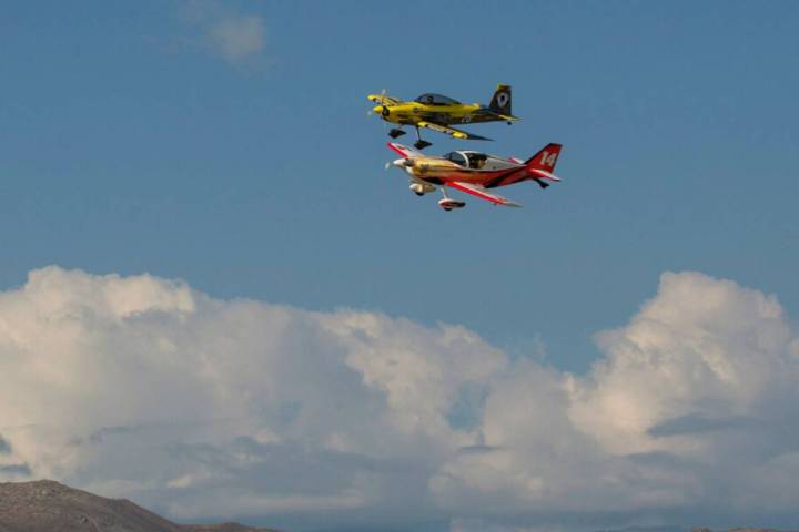 Brett Schuck (14) and Robert Swortzel (26) race during the National Championship Air Races over ...