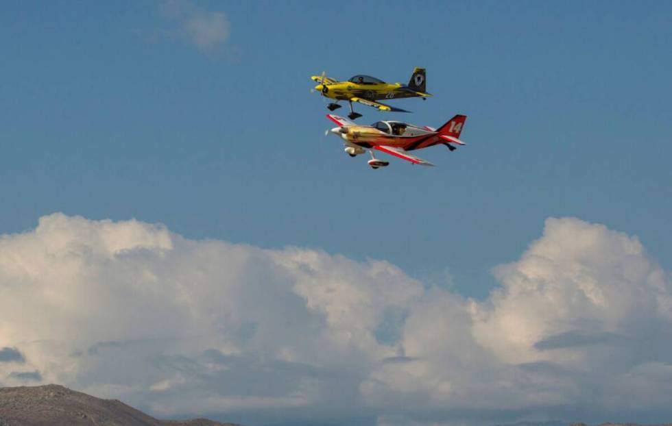 Brett Schuck (14) and Robert Swortzel (26) race during the National Championship Air Races over ...